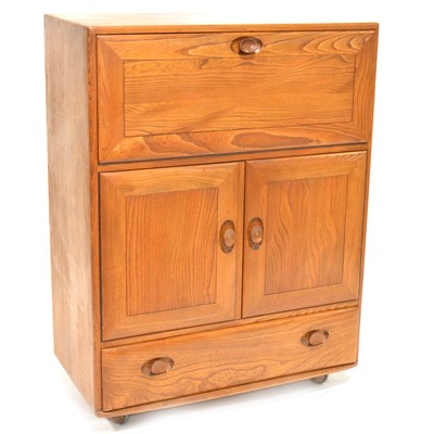 Lot 557 - Ercol, a beech and elm serving cabinet, model 469