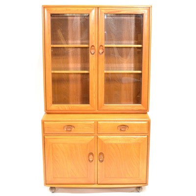 Lot 554 - Ercol, beech and elm glazed cabinet