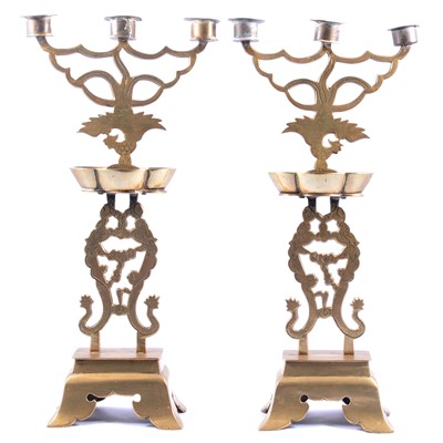 Lot 187 - Pair of cast brass Chinese three-light candelabra