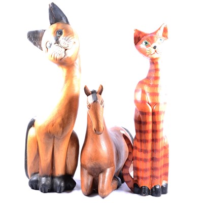 Lot 103 - Six large carved wooden cats, and carved wooden horse