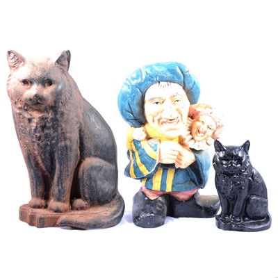 Lot 106 - Three cast iron door stops