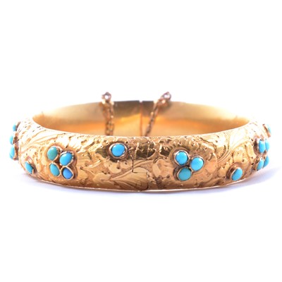 Lot 312 - A Victorian yellow metal and turquoise half hinged bangle.