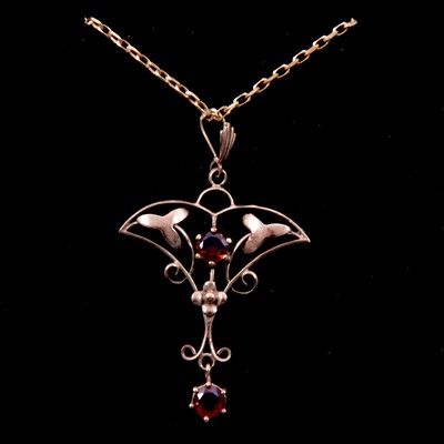 Lot 313 - An Edwardian garnet pendant and chain.
