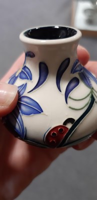 Lot 134 - Five miniature Moorcroft Pottery vases