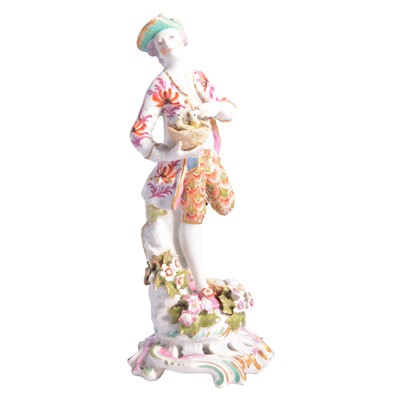 Lot 87 - Chelsea figure, with birds in a basket