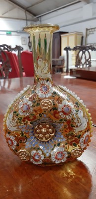 Lot 136 - Bohemian overlaid ruby glass flute and enamelled amber glass flask.