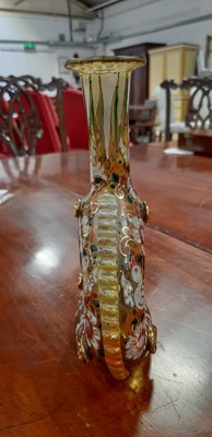 Lot 136 - Bohemian overlaid ruby glass flute and enamelled amber glass flask.