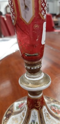 Lot 136 - Bohemian overlaid ruby glass flute and enamelled amber glass flask.