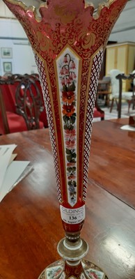 Lot 136 - Bohemian overlaid ruby glass flute and enamelled amber glass flask.