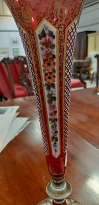 Lot 136 - Bohemian overlaid ruby glass flute and enamelled amber glass flask.